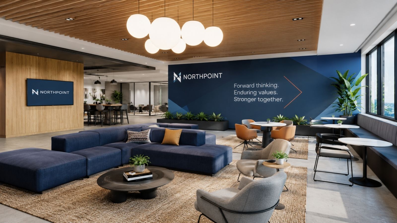 Khu lounge văn phòng hiện đại với sofa xanh, tường thương hiệu nổi bật và không gian tiếp khách sang trọng